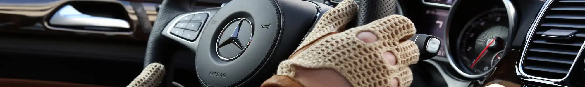 Driving gloves on a steering wheel